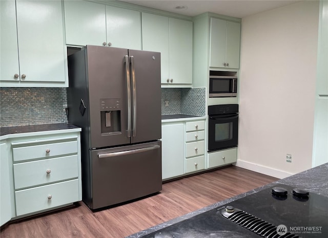463 Humble Hill Rd, Sequim, WA 98382 - kitchen featuring stainless steel appliances, dark wood-style flooring, tasteful backsplash, and baseboards