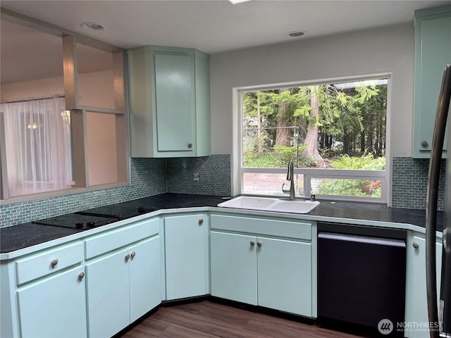 463 Humble Hill Rd, Sequim, WA 98382 - kitchen featuring dishwashing machine, a sink, dark countertops, backsplash, and dark wood-style floors