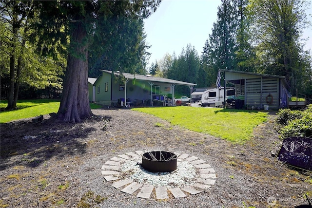 463 Humble Hill Rd, Sequim, WA 98382 - rear view of property with a fire pit and a yard