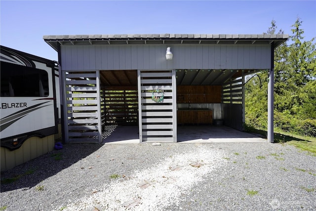 463 Humble Hill Rd, Sequim, WA 98382 - view of vehicle parking with an exterior structure and a carport