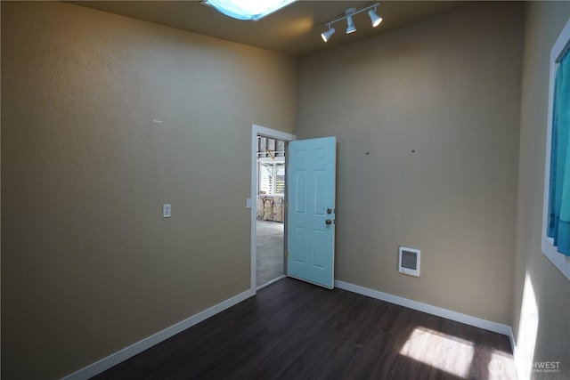 463 Humble Hill Rd, Sequim, WA 98382 - spare room featuring dark wood finished floors, baseboards, and rail lighting