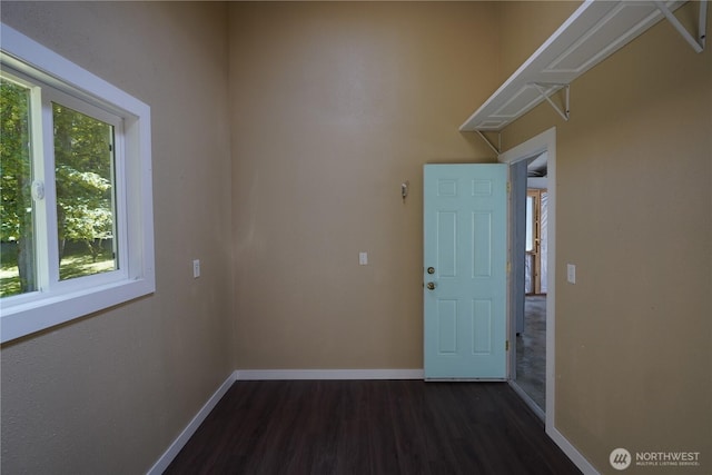 463 Humble Hill Rd, Sequim, WA 98382 - laundry area featuring dark wood-type flooring and baseboards