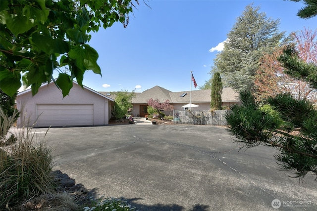 190 Twin Peaks Rd, Selah, WA 98942 - view of front of home with concrete driveway, a garage, and stucco siding