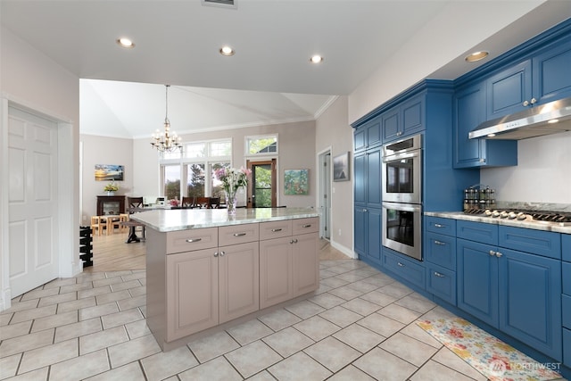 190 Twin Peaks Rd, Selah, WA 98942 - kitchen featuring under cabinet range hood, stainless steel appliances, crown molding, blue cabinets, and lofted ceiling