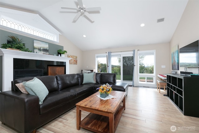 190 Twin Peaks Rd, Selah, WA 98942 - living area featuring a fireplace, vaulted ceiling, light wood-style floors, a ceiling fan, and recessed lighting