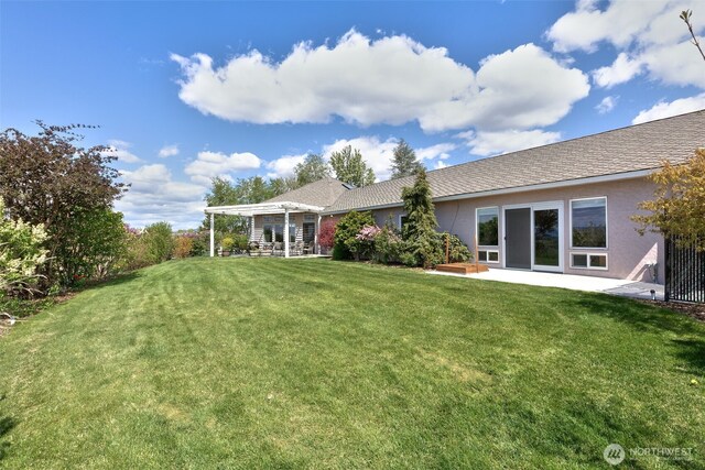 190 Twin Peaks Rd, Selah, WA 98942 - rear view of house featuring a lawn, stucco siding, and a patio