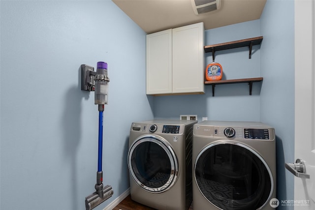 3007 Belmonte Ln, Everett, WA 98201 - laundry room with washer and clothes dryer, cabinet space, and baseboards