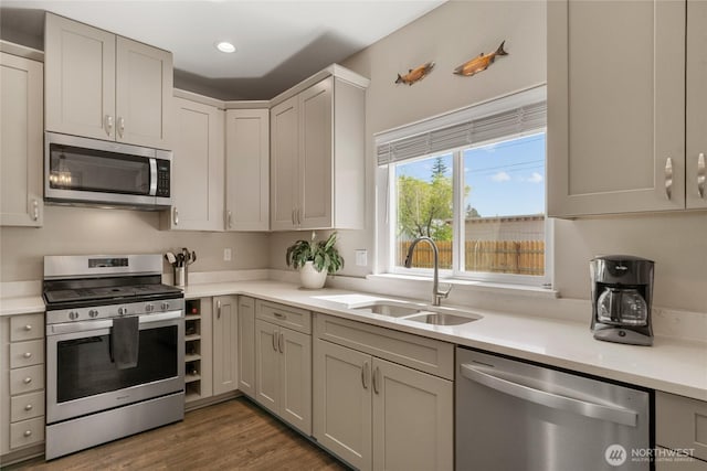 610 Laura Ln, Ellensburg, WA 98926 - kitchen with appliances with stainless steel finishes, a sink, light countertops, dark wood-style floors, and recessed lighting