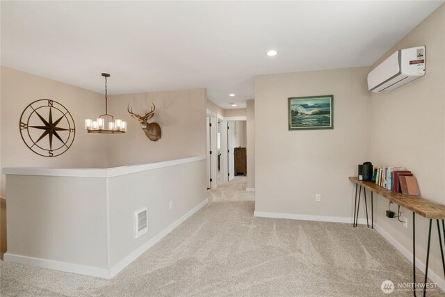 610 Laura Ln, Ellensburg, WA 98926 - hall with a wall unit AC, carpet flooring, baseboards, recessed lighting, and a chandelier