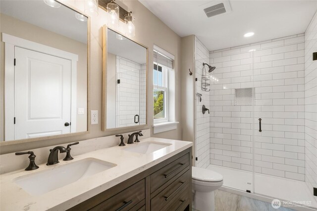 610 Laura Ln, Ellensburg, WA 98926 - bathroom with a shower stall, double vanity, toilet, and recessed lighting