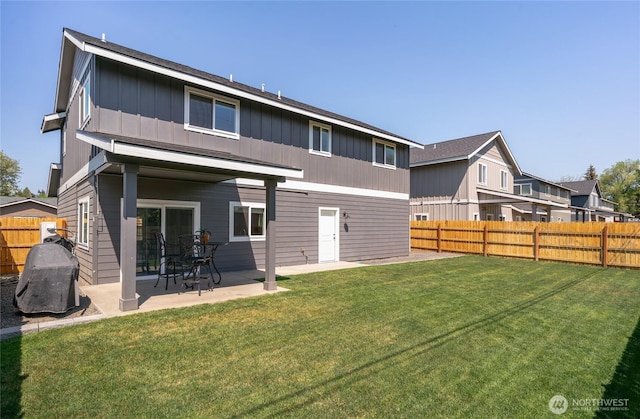 610 Laura Ln, Ellensburg, WA 98926 - back of property with board and batten siding and a patio area