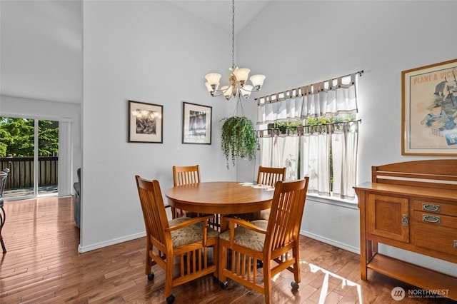 3016 97th Pl SE, Everett, WA 98208 - dining room featuring wood finished floors, baseboards, a chandelier, and high vaulted ceiling