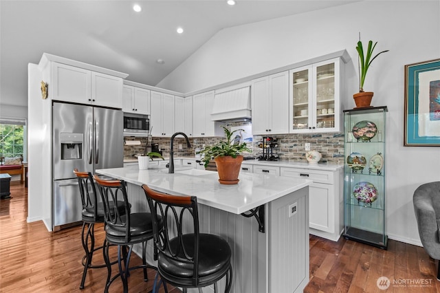 3016 97th Pl SE, Everett, WA 98208 - kitchen with appliances with stainless steel finishes, lofted ceiling, dark wood-style flooring, white cabinets, and recessed lighting