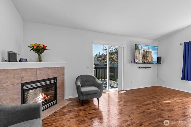 3016 97th Pl SE, Everett, WA 98208 - sitting room with wood finished floors, a tile fireplace, and baseboards
