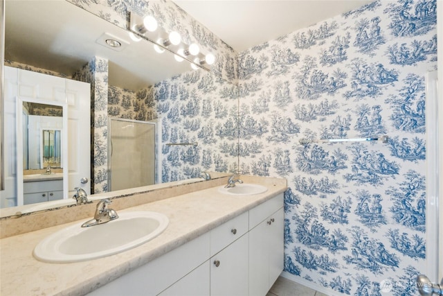 3116 164th St SW Unit 1704, Lynnwood, WA 98087 - bathroom with double vanity, a shower stall, wallpapered walls, and tile patterned flooring