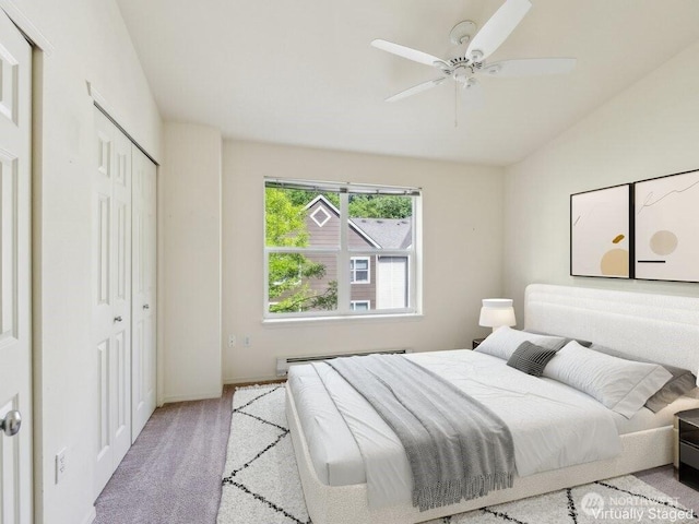 3116 164th St SW Unit 1704, Lynnwood, WA 98087 - bedroom featuring carpet flooring, baseboard heating, a closet, baseboards, and a ceiling fan