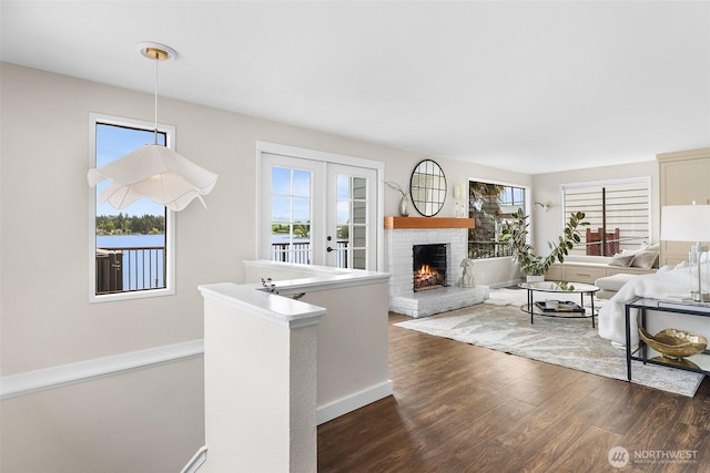 26736 138th Pl SE, Kent, WA 98042 - living room featuring plenty of natural light, dark wood-style floors, a brick fireplace, and baseboards