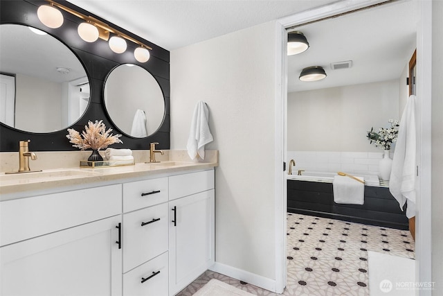 26736 138th Pl SE, Kent, WA 98042 - bathroom with double vanity, a garden tub, and baseboards