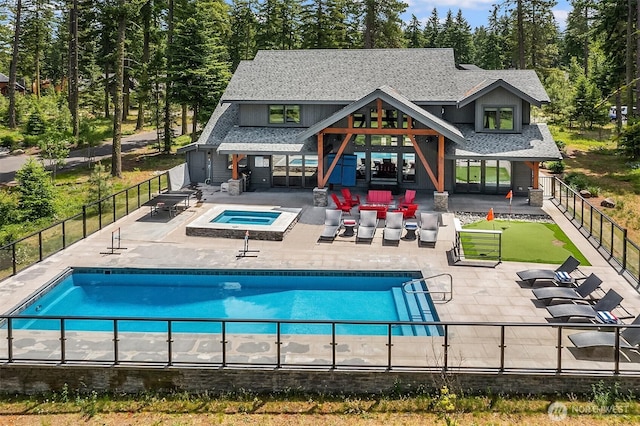 501 Maple Leaf Loop, Cle Elum, WA 98922 - view of swimming pool featuring an in-ground hot tub, a patio area, and a fenced backyard