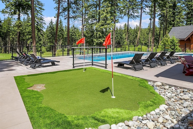 501 Maple Leaf Loop, Cle Elum, WA 98922 - view of swimming pool with a putting green, a patio area, and view of wooded area