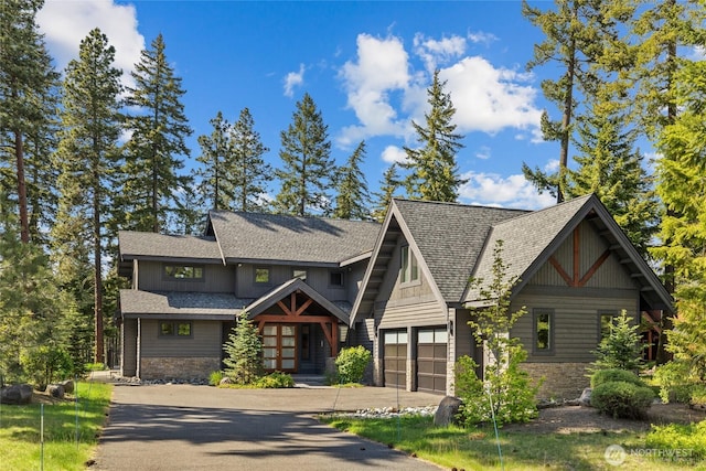 501 Maple Leaf Loop, Cle Elum, WA 98922 - view of front of property with stone siding, concrete driveway, an attached garage, and a shingled roof