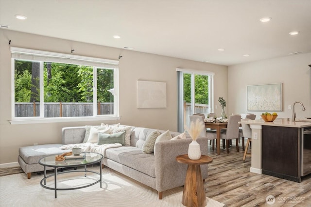 12304 55th Dr SE, Snohomish, WA 98296 - living area featuring light wood-style flooring, recessed lighting, and baseboards