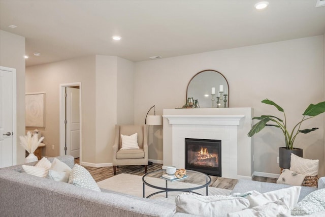 12304 55th Dr SE, Snohomish, WA 98296 - living room featuring a fireplace, baseboards, recessed lighting, and wood finished floors