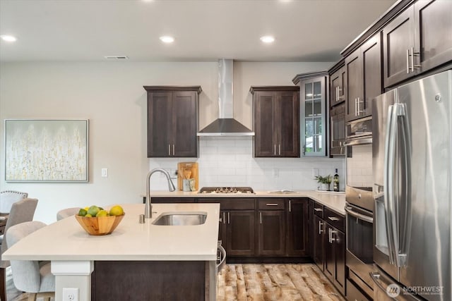12304 55th Dr SE, Snohomish, WA 98296 - kitchen featuring stainless steel appliances, a sink, wall chimney exhaust hood, light countertops, and dark brown cabinetry