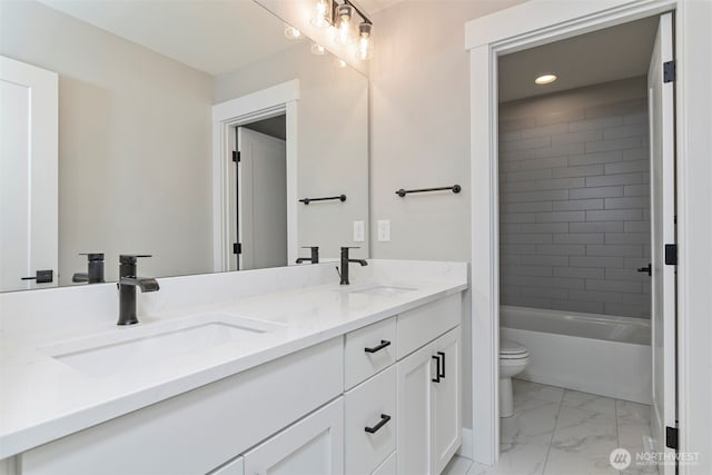 13045 75th Pl S, Seattle, WA 98178 - full bathroom with double vanity, toilet, marble look tile flooring, recessed lighting, and bathtub / shower combination