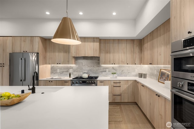 12833 NE 91st St, Kirkland, WA 98033 - kitchen featuring light brown cabinetry, premium appliances, light countertops, modern cabinets, and recessed lighting