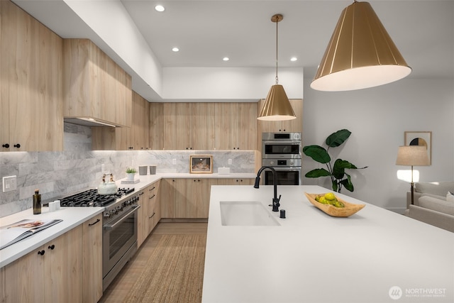 12833 NE 91st St, Kirkland, WA 98033 - kitchen featuring light brown cabinetry, a sink, stainless steel appliances, light countertops, and recessed lighting