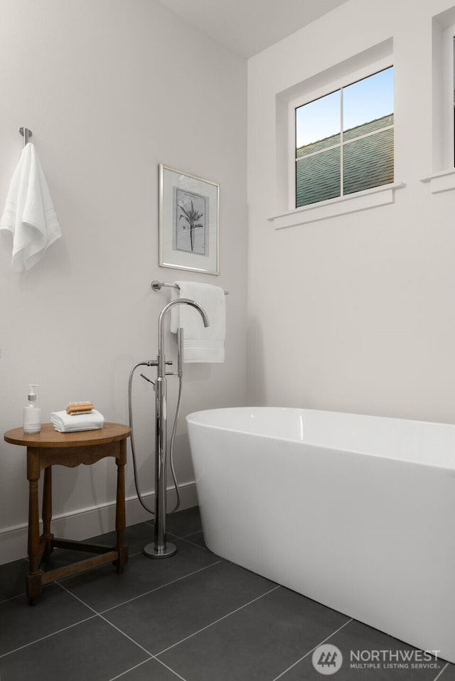 12833 NE 91st St, Kirkland, WA 98033 - bathroom featuring a soaking tub, tile patterned floors, and baseboards
