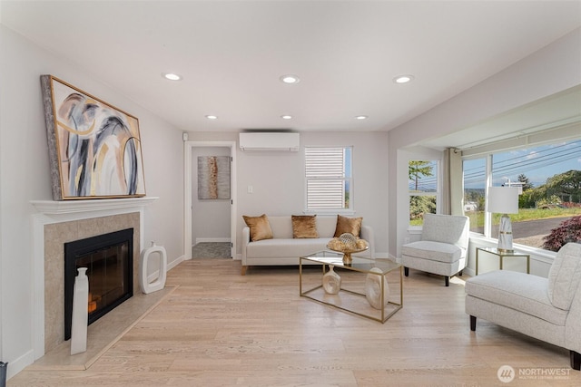 7408 S 128th St, Seattle, WA 98178 - living room featuring a wall mounted air conditioner, light wood-style flooring, baseboards, recessed lighting, and a fireplace