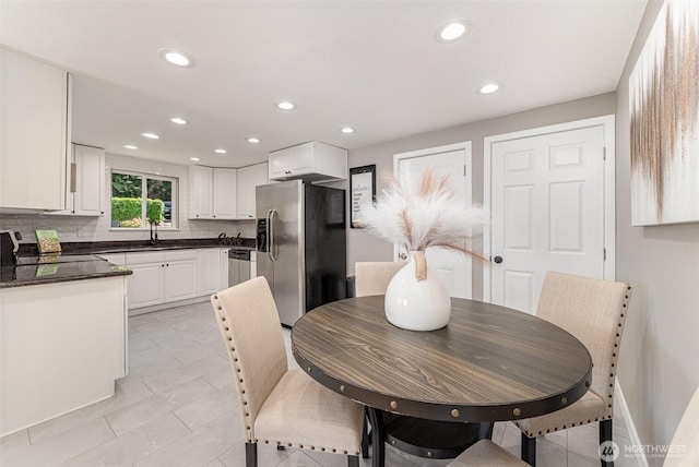7408 S 128th St, Seattle, WA 98178 - dining room with recessed lighting, light tile patterned floors, and baseboards