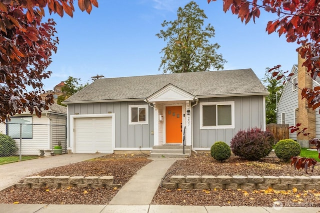 207 N Colville St, Walla Walla, WA 99362 - bungalow featuring board and batten siding, an attached garage, driveway, and roof with shingles