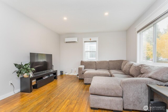 207 N Colville St, Walla Walla, WA 99362 - living room with a wall mounted air conditioner, light wood finished floors, recessed lighting, and baseboards