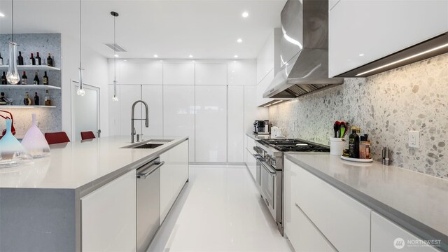 903 N 33rd Pl, Renton, WA 98056 - kitchen featuring a sink, modern cabinets, appliances with stainless steel finishes, wall chimney exhaust hood, and white cabinetry