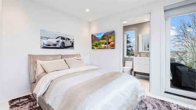 903 N 33rd Pl, Renton, WA 98056 - bedroom with recessed lighting, ensuite bath, and baseboards