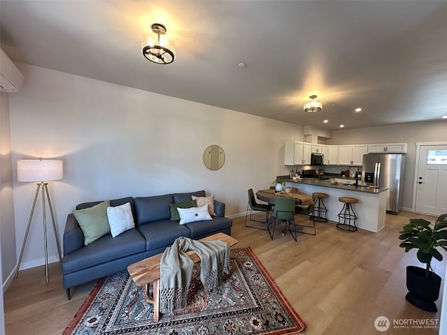 1712 Sunup Loop, Bellingham, WA 98226 - living area featuring light wood-style flooring, recessed lighting, and a wall mounted AC