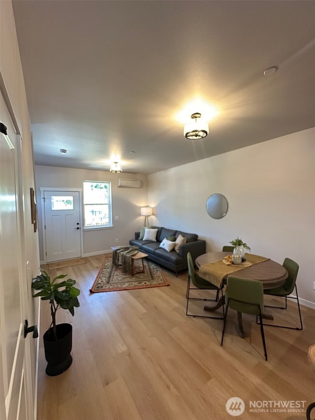1712 Sunup Loop, Bellingham, WA 98226 - living room featuring a wall mounted air conditioner and light wood-style floors