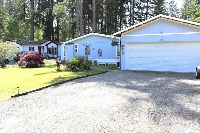 17340 Sargent Rd SW Unit 54, Rochester, WA 98579 - view of front of home featuring gravel driveway and a front lawn