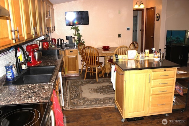17340 Sargent Rd SW Unit 54, Rochester, WA 98579 - kitchen with range with electric cooktop, a sink, dark countertops, dark wood-type flooring, and a center island