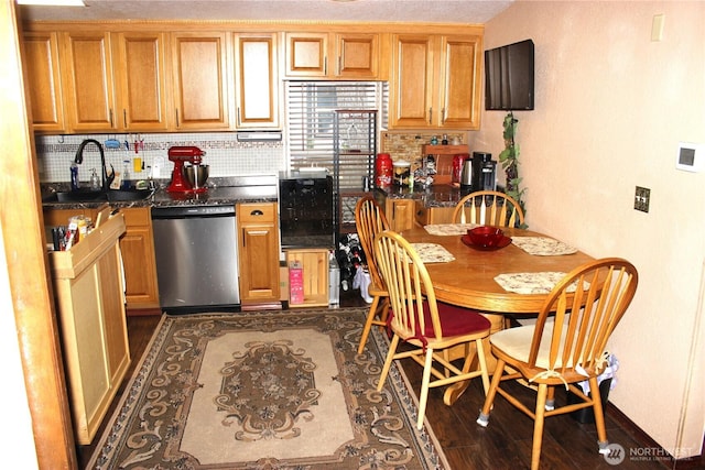 17340 Sargent Rd SW Unit 54, Rochester, WA 98579 - kitchen with dishwasher, a sink, backsplash, and dark countertops