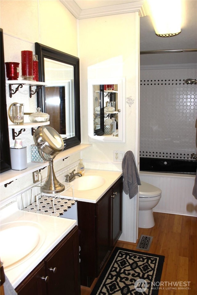 17340 Sargent Rd SW Unit 54, Rochester, WA 98579 - bathroom with vanity, toilet, wood finished floors, and ornamental molding