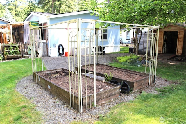 17340 Sargent Rd SW Unit 54, Rochester, WA 98579 - view of play area featuring a vegetable garden and a lawn