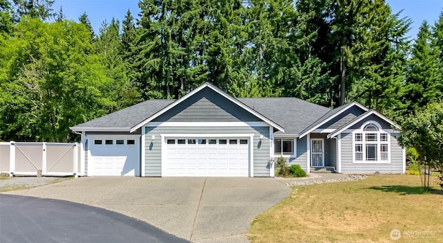 1207 139th St NW, Gig Harbor, WA 98332 - single story home featuring concrete driveway, a garage, a gate, and a shingled roof