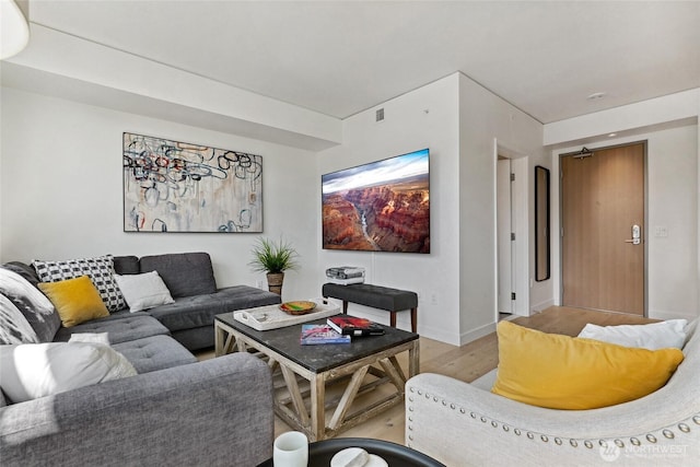 2510 6th Ave Unit 2003, Seattle, WA 98121 - living room with light wood-style floors and baseboards