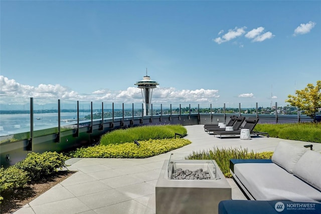 2510 6th Ave Unit 2003, Seattle, WA 98121 - view of patio featuring an outdoor living space and a water view