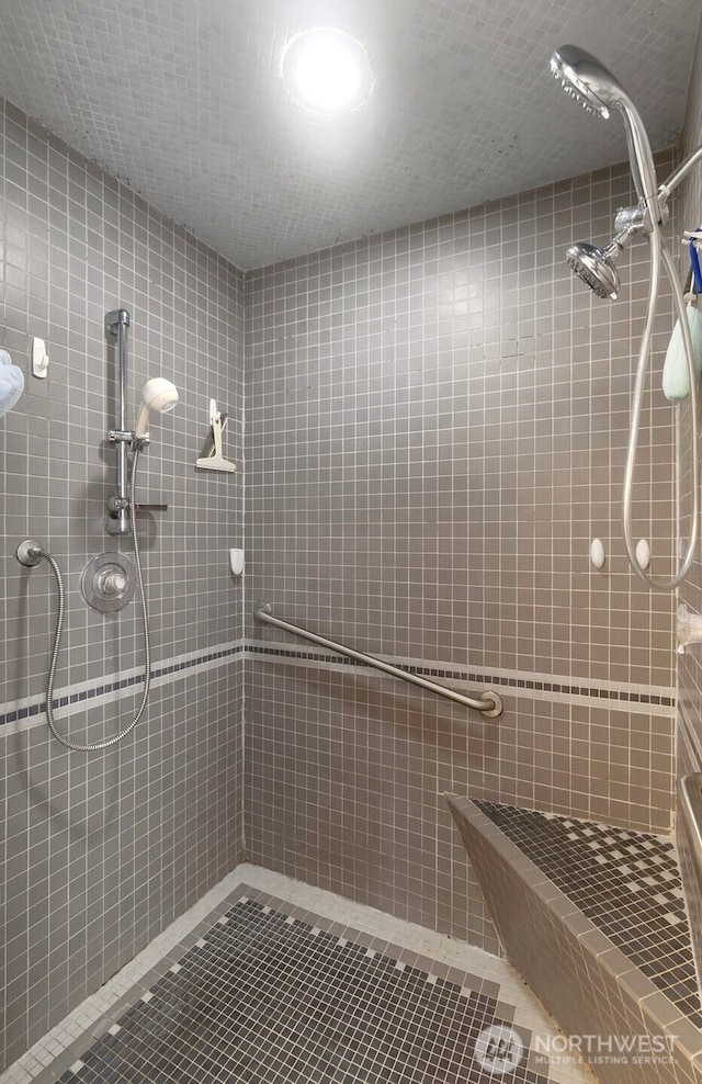 280 Surf St, Westport, WA 98595 - full bathroom with a tile shower, tile patterned flooring, and tile walls