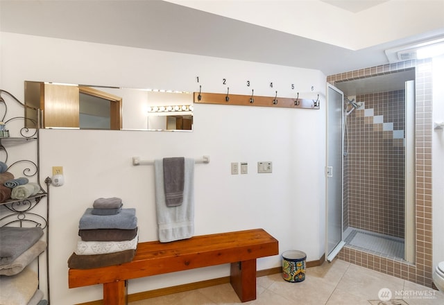 280 Surf St, Westport, WA 98595 - full bathroom featuring a stall shower, toilet, tile patterned floors, and baseboards